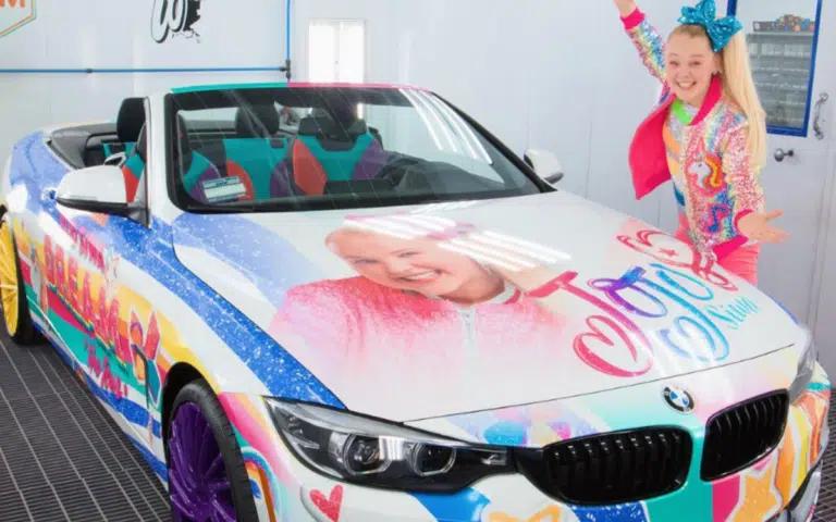 JoJo Siwa had her Lamborghini Urus wrapped with multiple images of her own face