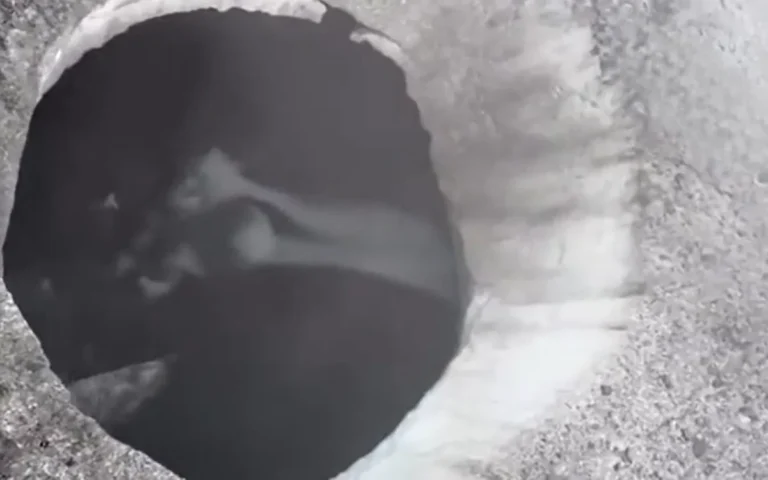 Alaskan helicopter pilot shows off freaky 'bottomless' holes in melting glaciers