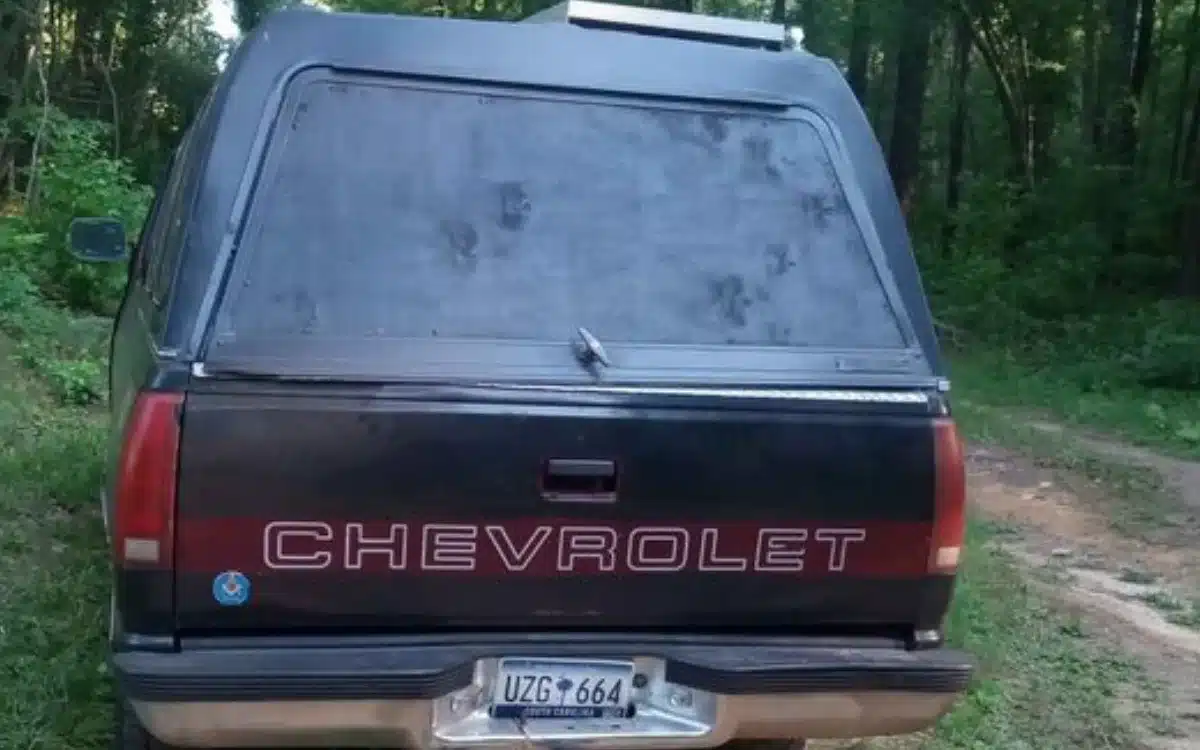 This old Chevy truck transforms into a stealthy camper with a secret wood cabin