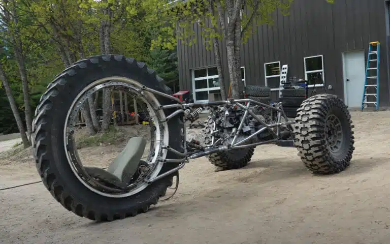 Idaho guys test a 3x3 custom build trike with pushrod suspension, rear-wheel steering, and a diesel-powered frame in their wildest off-road project yet