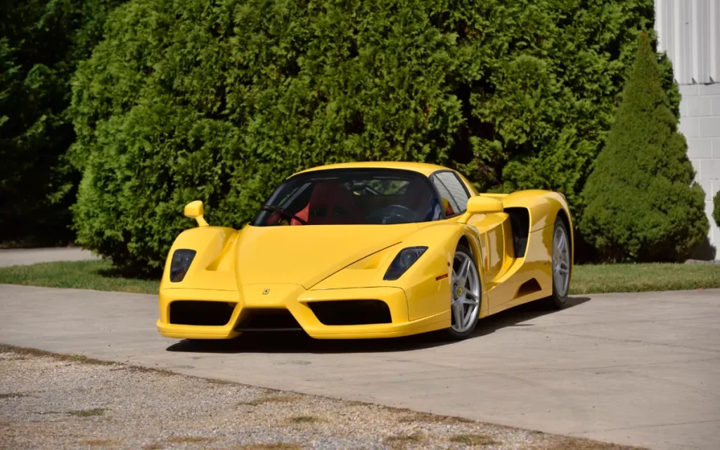 A yellow Ferrari Enzo supercar just shattered expectations by selling for a record $17,900,000 at auction