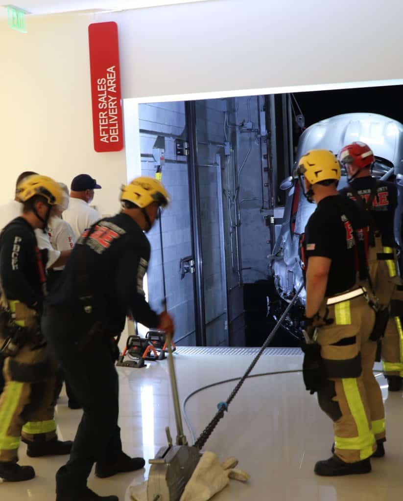 Firefighters pull Ferrari from elevator