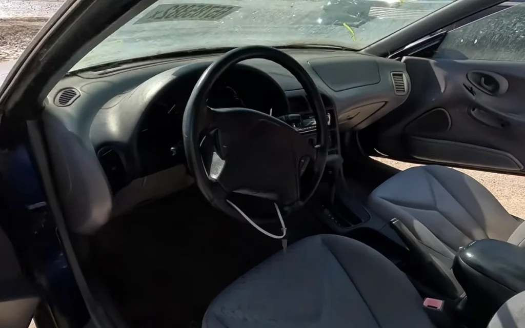 A hidden corner of an Indianapolis Copart yard revealed an emotional surprise: a Mitsubishi 3000GT and a neglected Ford Probe waiting for a second chance.