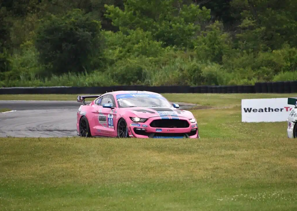 CEO of Ford is raced in the Mustang Challenge at Laguna Seca