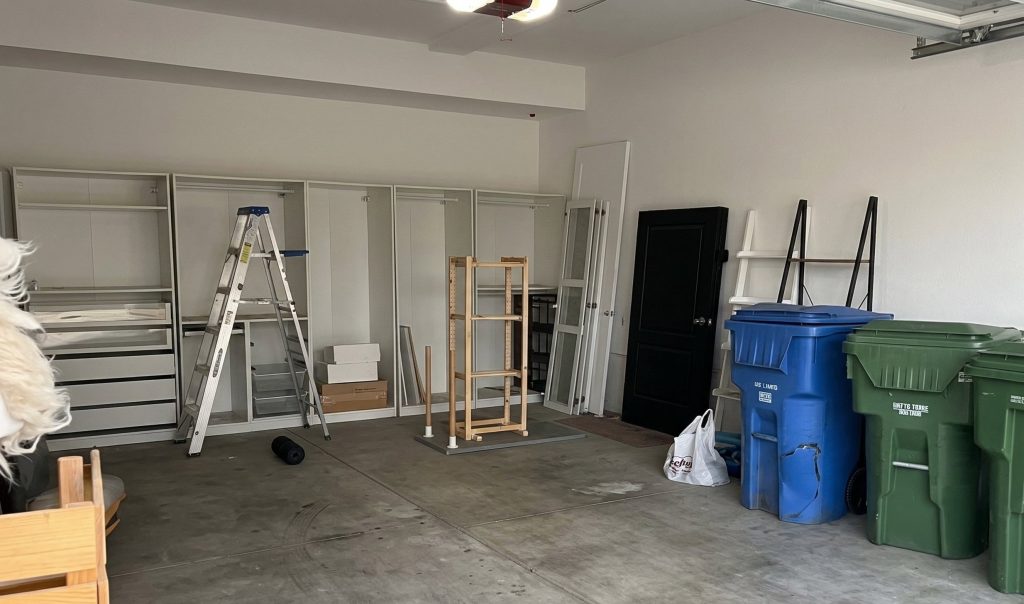 One homeowner completed a stunning garage makeover by using an IKEA closet and wallpaper to transform her boring parking space into a luxury room