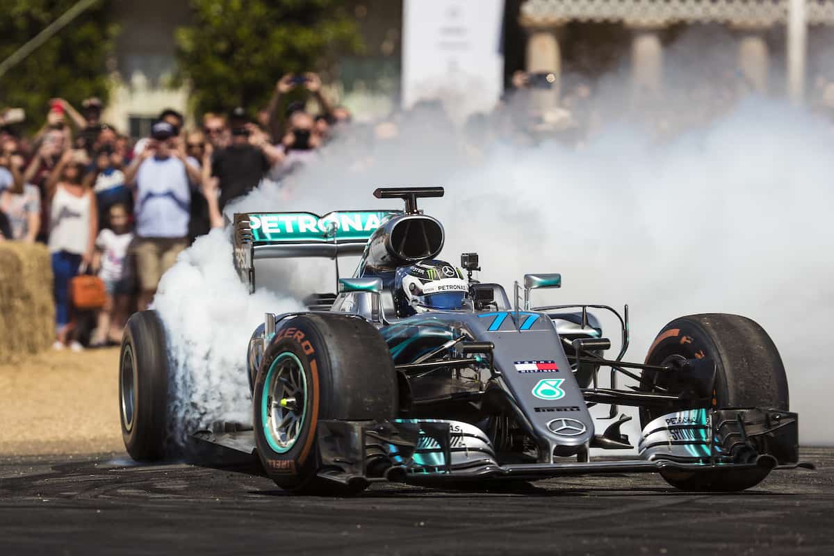 Mercedes F1 car doing donuts at Goodwood Festival of Speed