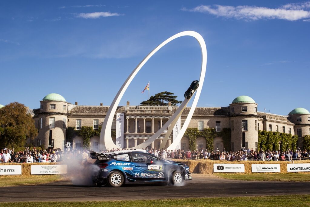 Ford rally car doing donuts in front of the Central Feature at the 2019 Goodwood Festival of Speed