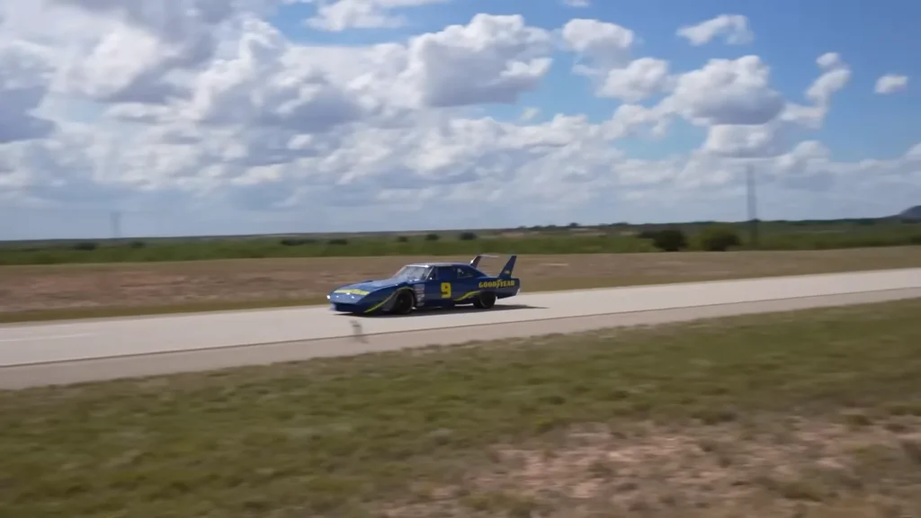 Emelia Hartford drove her barn find Plymouth Superbird NASCAR muscle car at 200mph for Goodyear