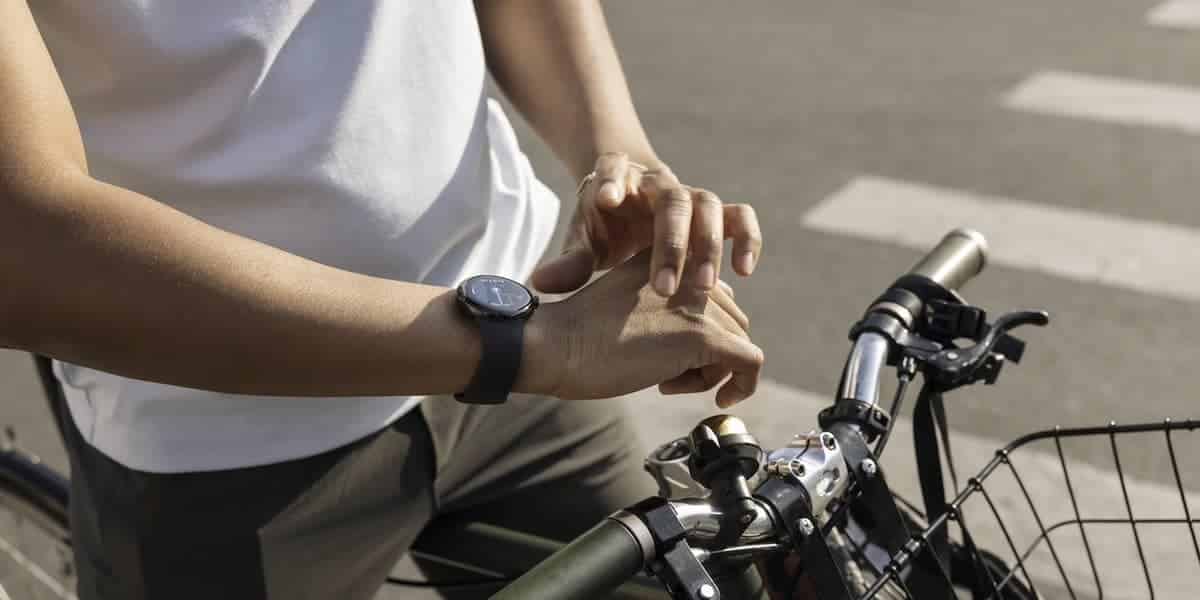 A person on bike uses the timepiece.