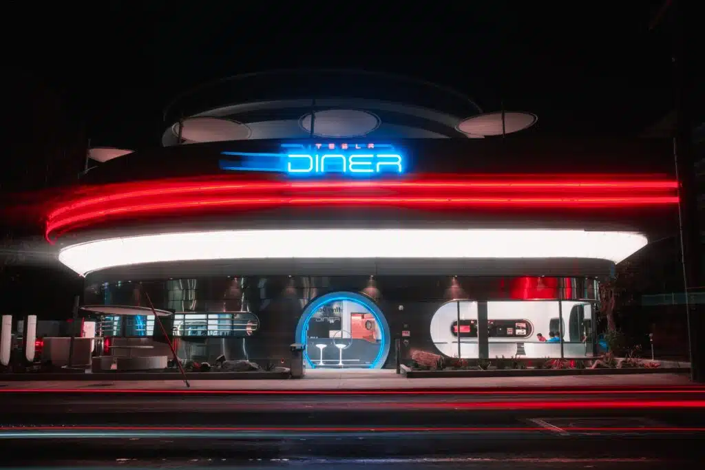 Burgers in Cybertruck boxes and robot popcorn at Tesla’s diner but not everyone’s impressed