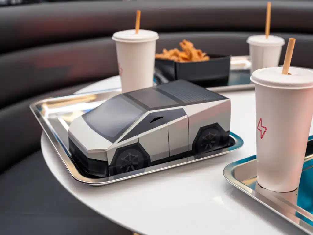 Burgers in Cybertruck boxes and robot popcorn at Tesla’s diner but not everyone’s impressed