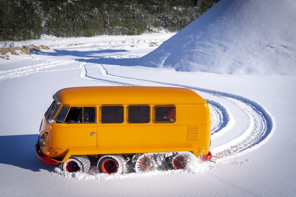 Half-track fox Volkswagen bus drifting on snow