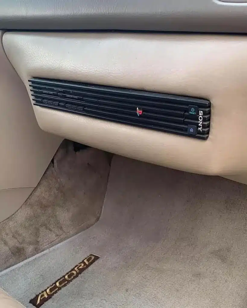 This Honda Accord hides a full PlayStation 2 setup in the dashboard