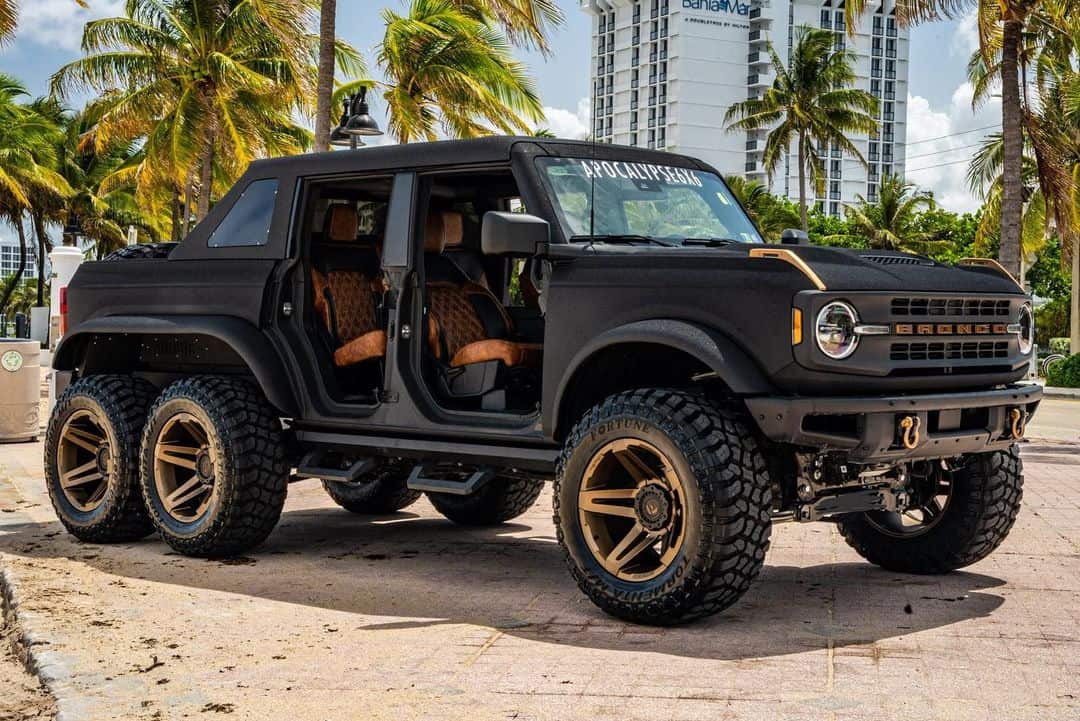 This dark horse is a 6x6 Ford Bronco from the side
