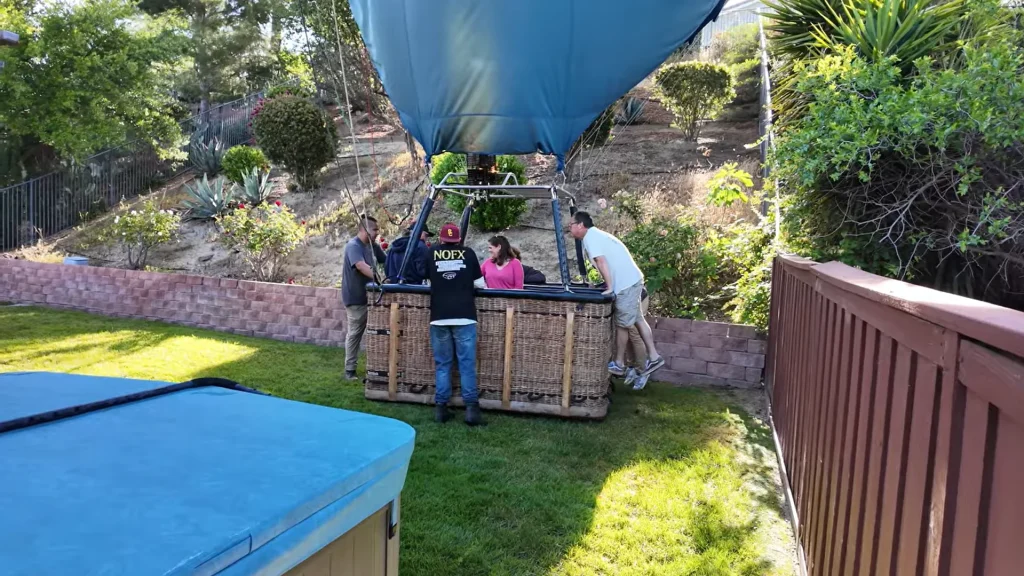 California man shocked to find hot air balloon with 13 strangers in his backyard