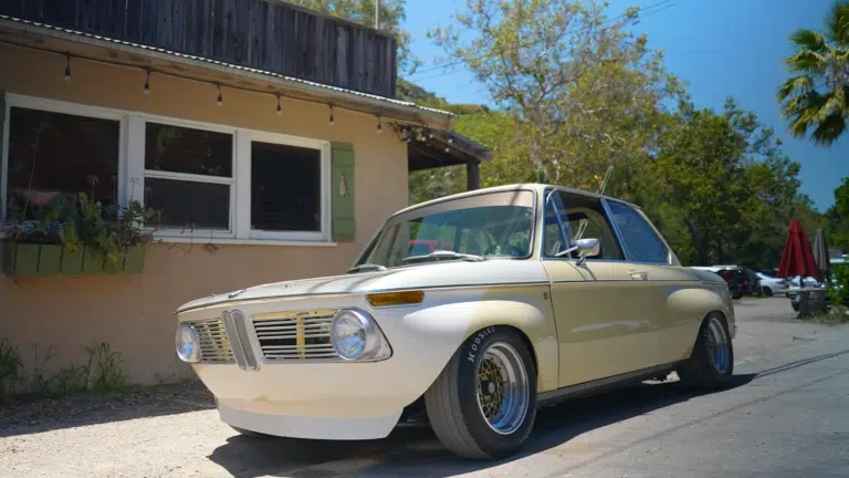 A BMW 2002 minimalist machine blends carbon fiber BMW, surfboard-inspired car design, lightweight sports car performance, and a custom BMW vision