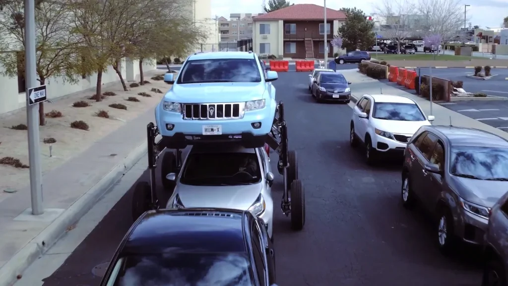 This Jeep Grand Cherokee SUV was modified so it could rise to nearly 9ft high and drive over traffic rather than sit in a jam
