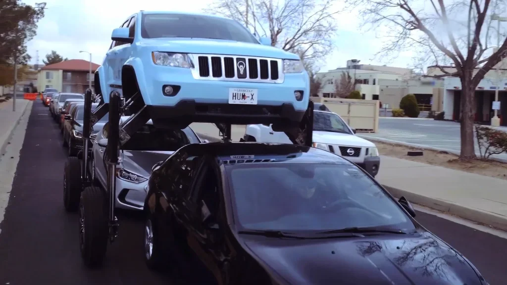 This Jeep Grand Cherokee SUV was modified so it could rise to nearly 9ft high and drive over traffic rather than sit in a jam