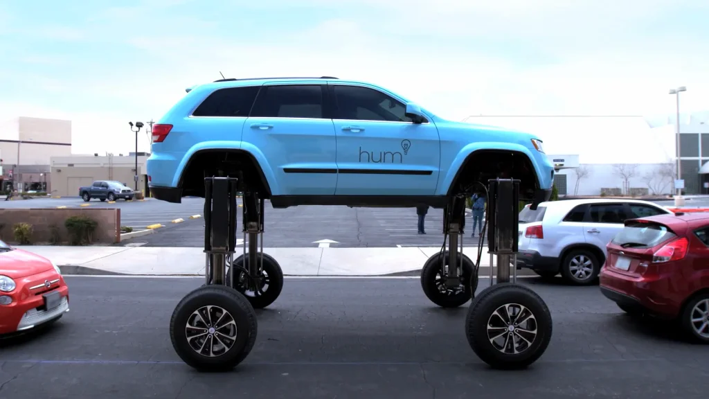 This Jeep Grand Cherokee SUV was modified so it could rise to nearly 9ft high and drive over traffic rather than sit in a jam