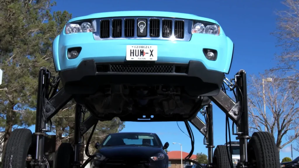 This Jeep Grand Cherokee SUV was modified so it could rise to nearly 9ft high and drive over traffic rather than sit in a jam