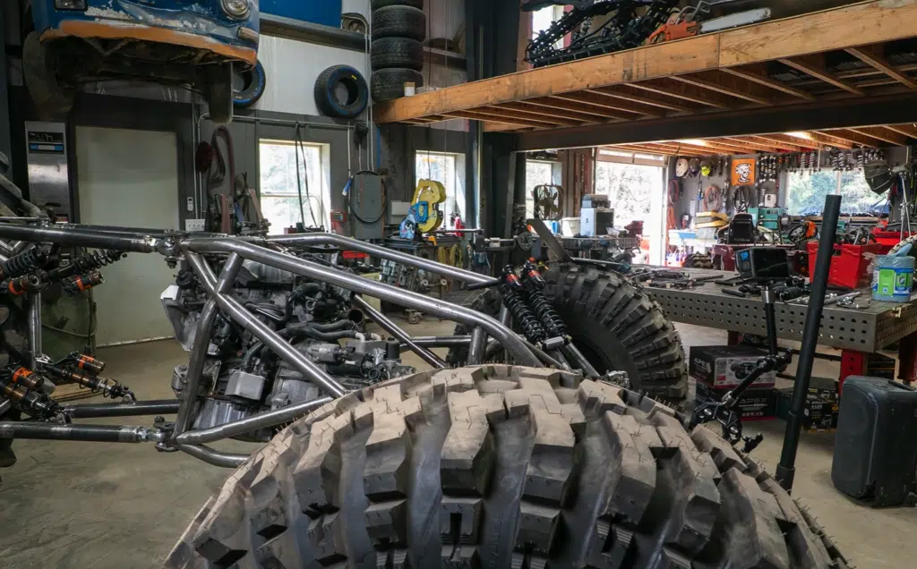 Idaho guys test a 3x3 custom build trike with pushrod suspension, rear-wheel steering, and a diesel-powered frame in their wildest off-road project yet