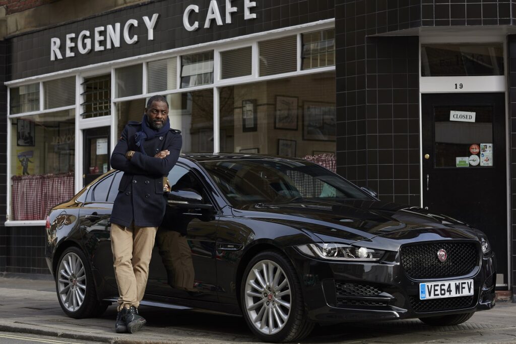 Idris Elba poses next to a Jag - could he be the next james bond? 