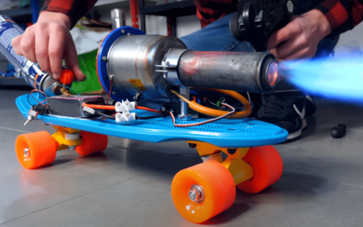 A home-built electric jet engine mounted on a tiny plastic skateboard