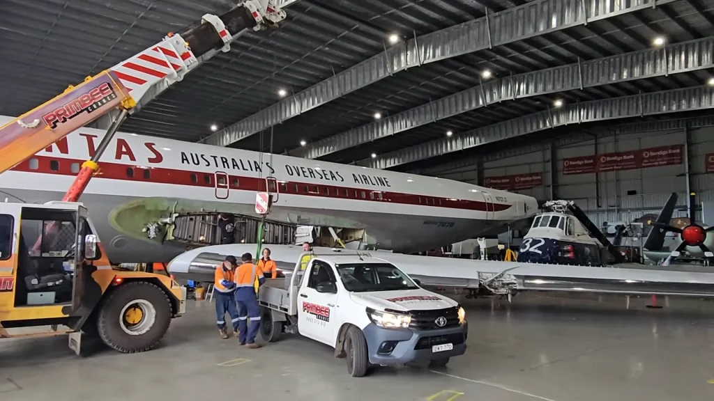 John Travolta's iconic Qantas Boeing 707 reassembly has begun with volunteers helping five-person team to give it a bright future
