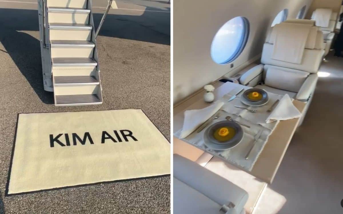 A welcome mat saying "Kim Air" and two seats in the cabin with food on their tray tables.