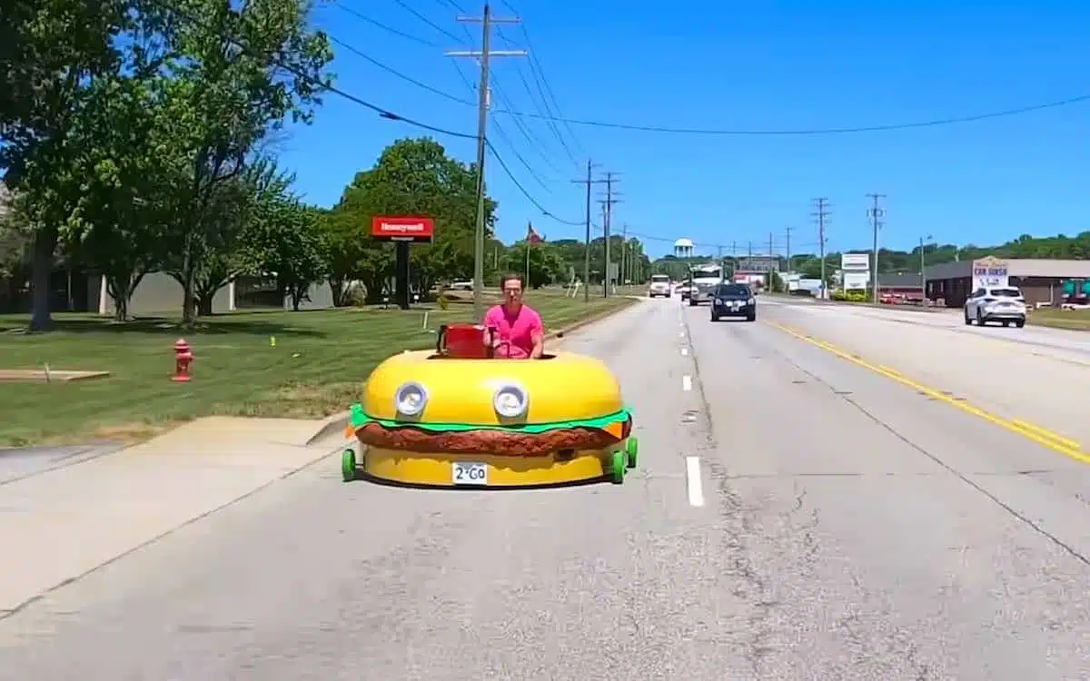 President Chey driving the Krabby Patty car down the road