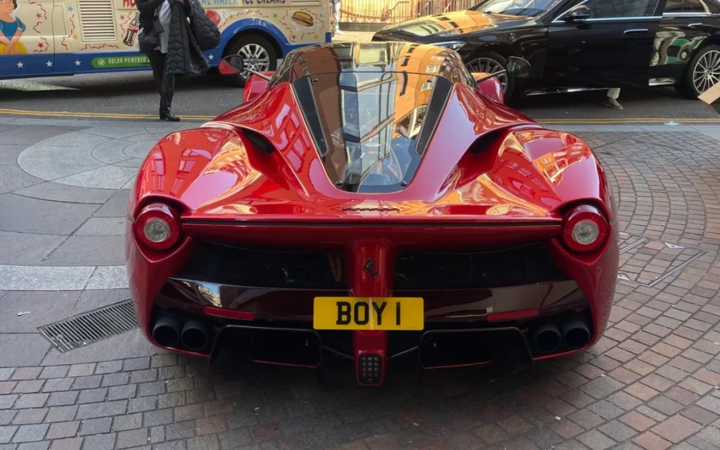 A Ferrari owner parked a rare LaFerrari with the eye-catching plate 'BOY 1' outside Harrods in London, and was promptly greeted with a parking ticket.