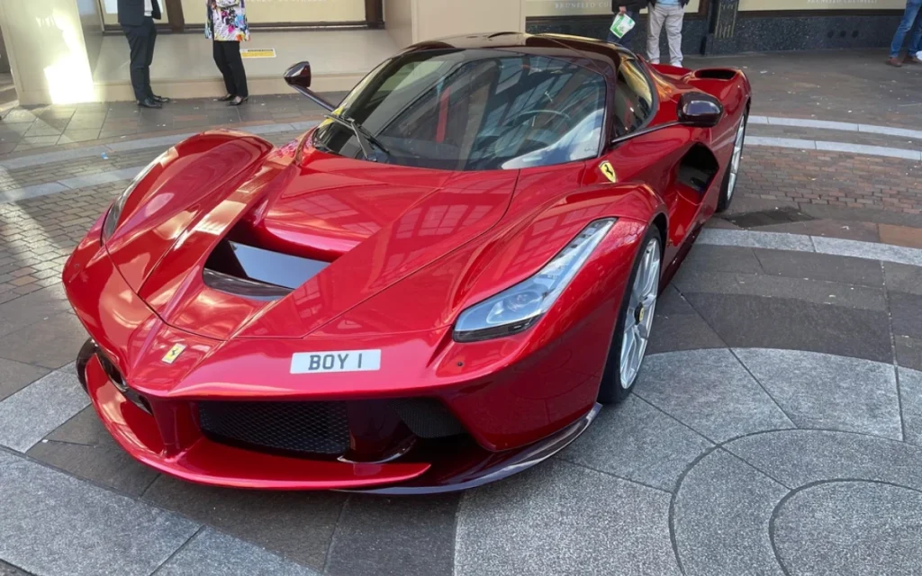 A Ferrari owner parked a rare LaFerrari with the eye-catching plate 'BOY 1' outside Harrods in London, and was promptly greeted with a parking ticket.