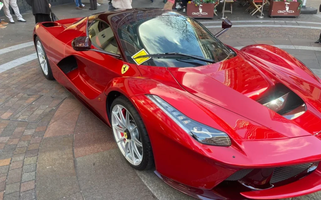 A Ferrari owner parked a rare LaFerrari with the eye-catching plate 'BOY 1' outside Harrods in London, and was promptly greeted with a parking ticket.