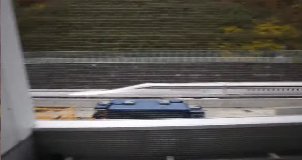 Breathtaking footage shows Japanese maglev train whizzing past at 310mph like a bullet while a crowd looks on stunned