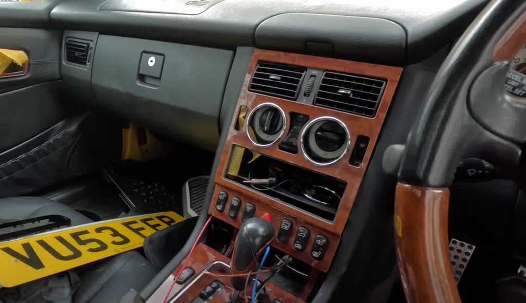 A Mercedes R170 SLK with heated seats, broken springs, and a stripped interior was bought for under $500 and revealed shocking unfinished modifications