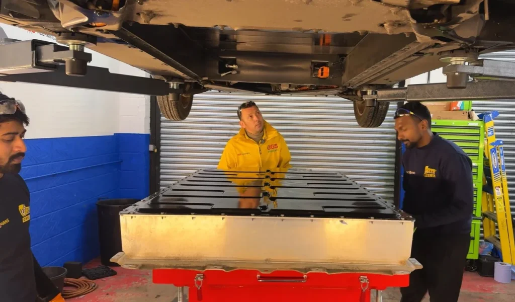 Discover how a technician saved a nearly scrap BMW electric car for $1,345 and performed a battery upgrade to double the driving range of the electric car