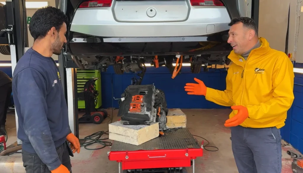 Discover how a technician saved a nearly scrap BMW electric car for $1,345 and performed a battery upgrade to double the driving range of the electric car