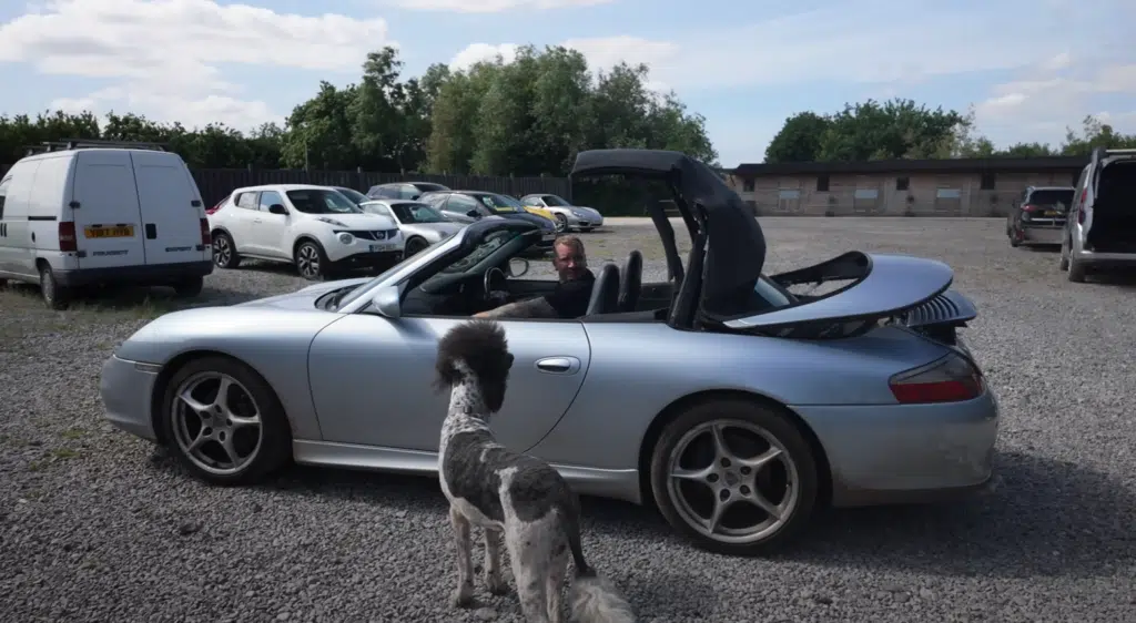 A fire-damaged Porsche 911 from a Copart auction was turned into a successful car restoration project and flipped for profit after careful repairs
