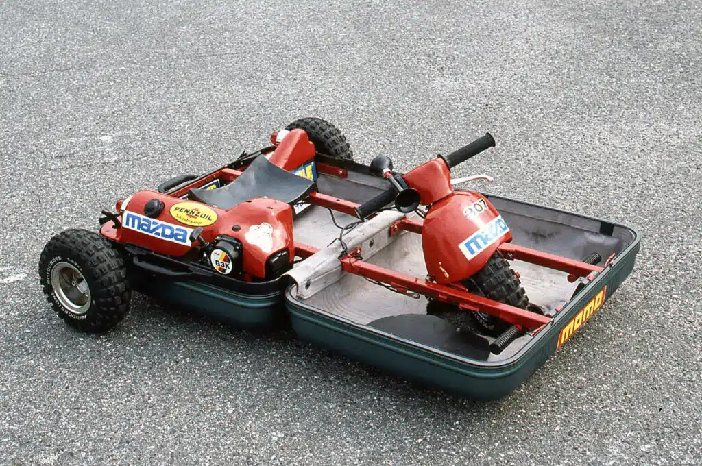 Mazda's suitcase car was assembled from parts sourced from a Honda scooter - and it could drive up to 18mph.