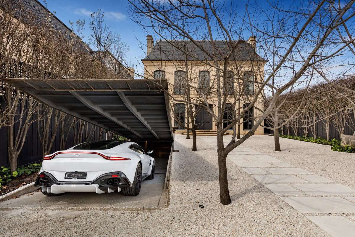 A car enters the secret James Bond garage at the Melbourne home.