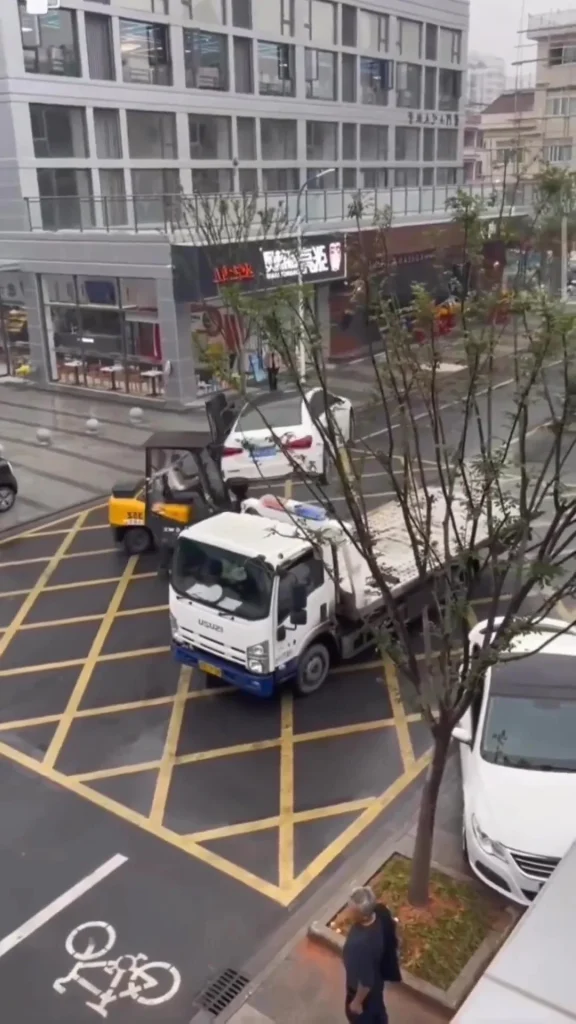 Illegal parking turns messy in China as Mercedes A-Class is lifted by forklift in controversial move