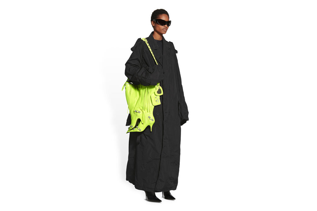 Model wearing Balenciaga boot bag