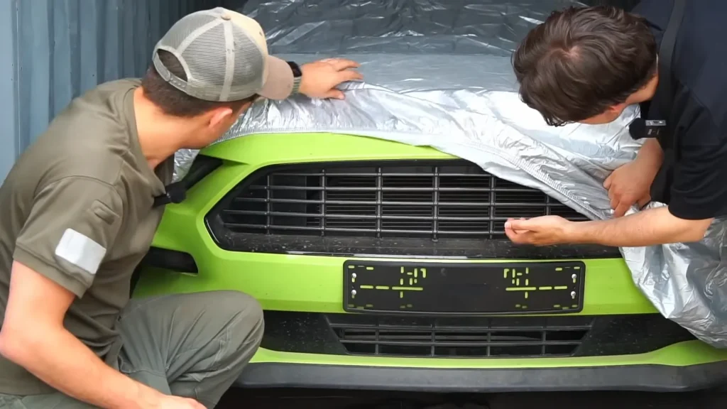 Man spends $25,000 on mystery container at cargo auction then shrieks as he sees what muscle car is behind the cover