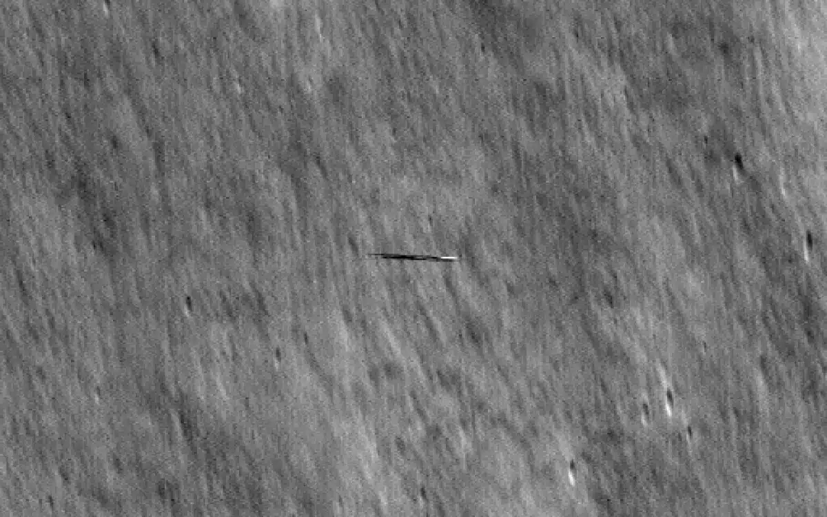 NASA reveals images of surfboard-shaped object orbiting the moon