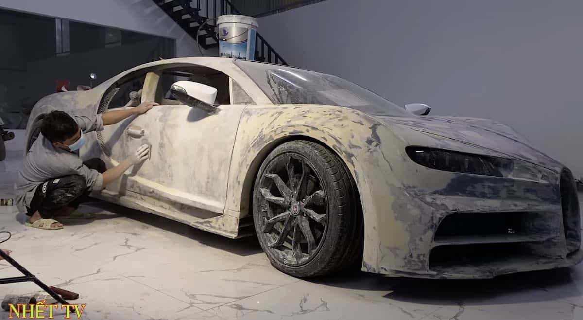 The partially finished Chiron as one person works on it.