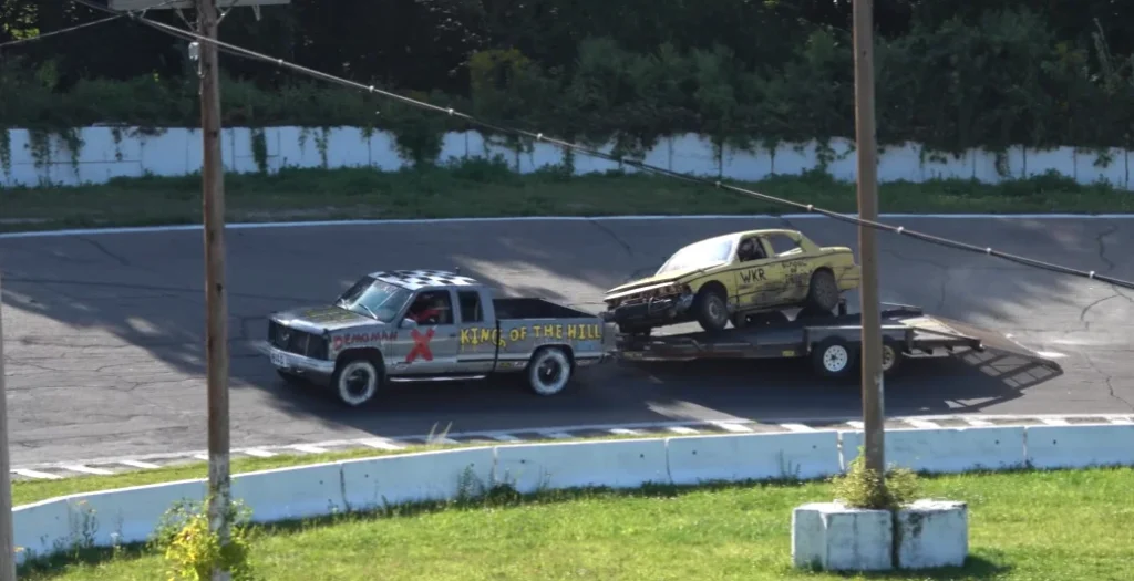 'New sport invented' as cars race round track behind trailer being towed and the first one to park on it wins