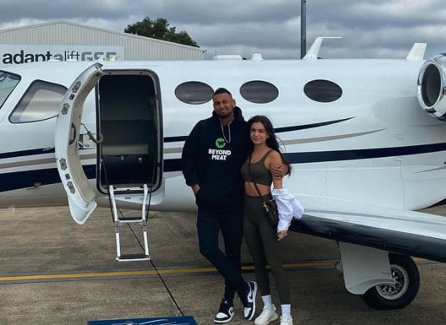 Nick Kyrgios in front of private jet