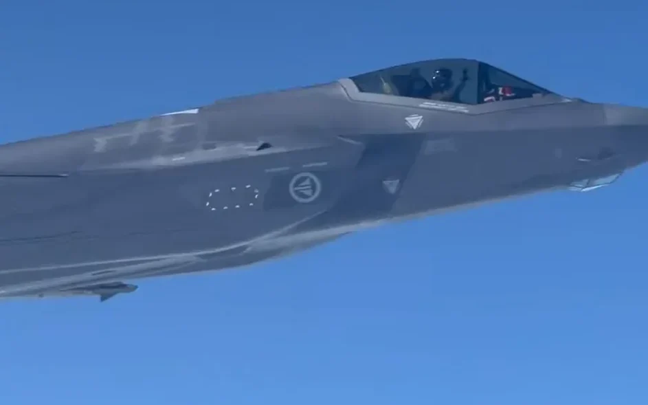 Norwegian football team flying home from World Cup look out of plane window and spot F-35 escorting them