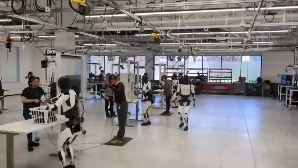 Optimus-robot-performing-a-useful-task-at-Tesla-factory