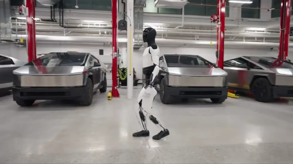 Optimus robot walking Elon Musk